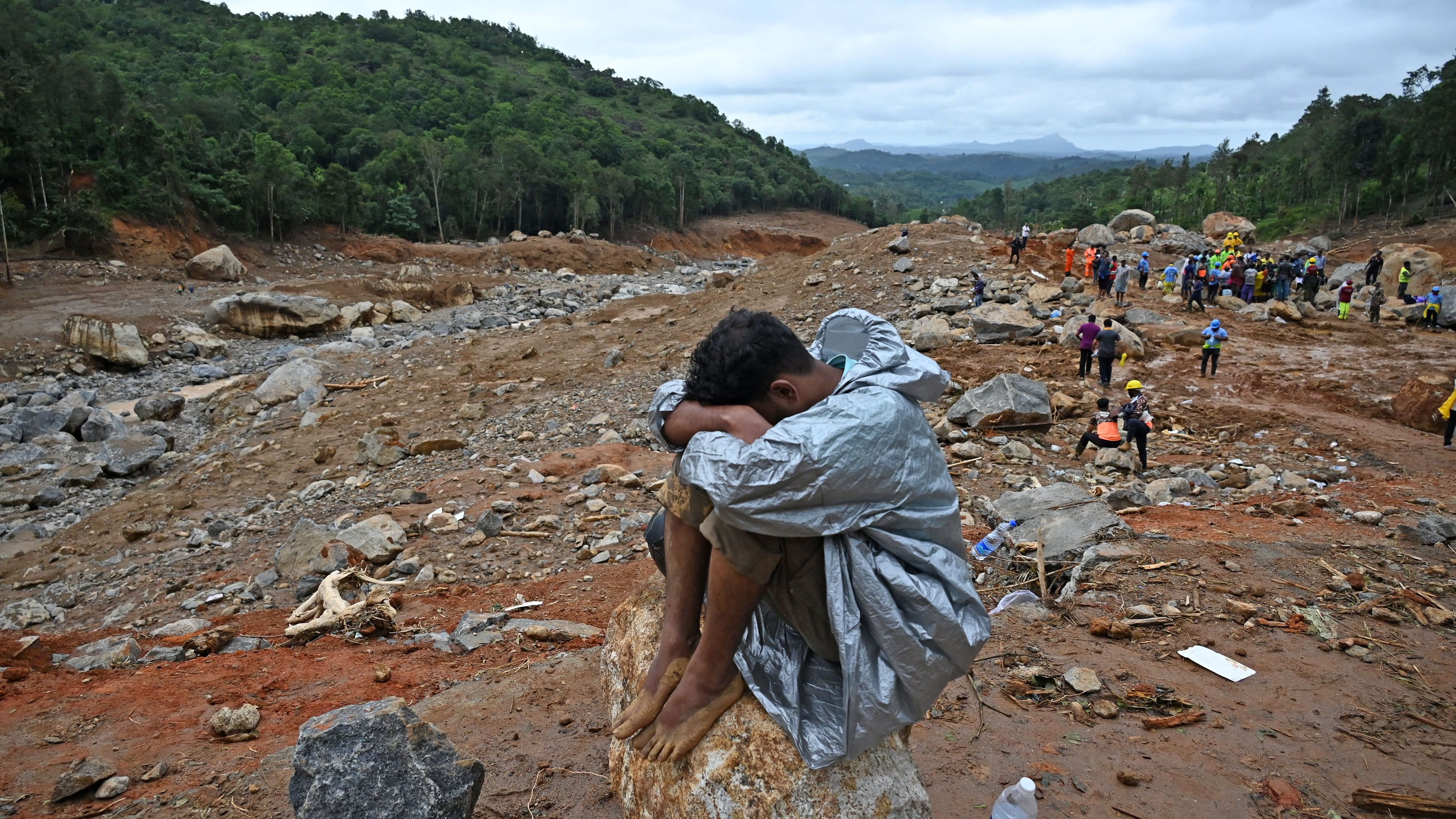 <div class="paragraphs"><p>Ajith a resident of Mundakkai sits on a bolder amid the landslide hit area, where he lost family members, in Wayanad, on Saturday, August 03, 2024.</p></div>